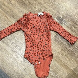 Rachel Orange and Black Floral Bodysuit with Ruffle Detail